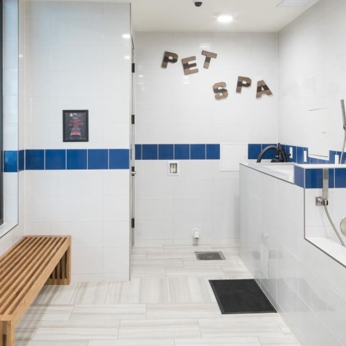 a bathroom with a white tile floor