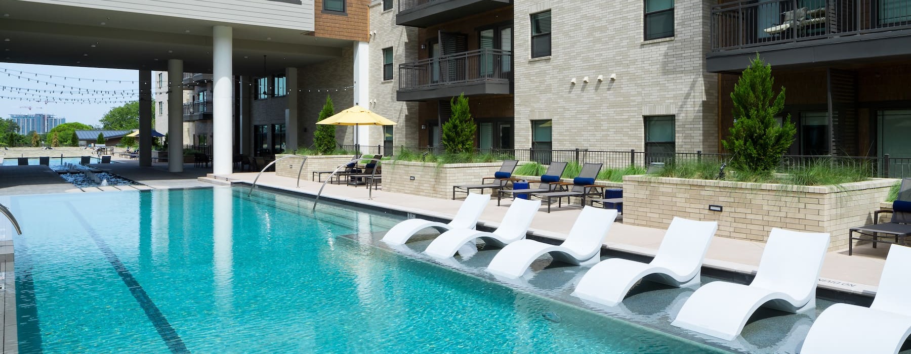 pool deck with nearby landscaping