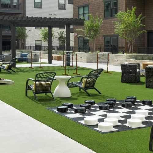 a courtyard with chairs and tables