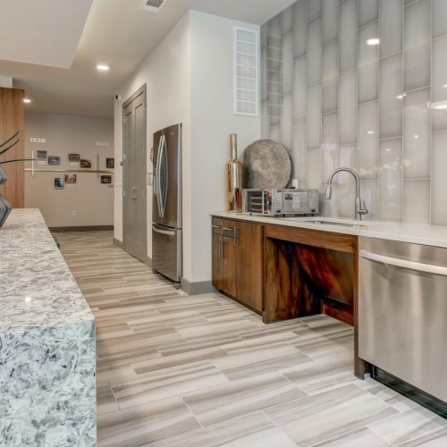 a kitchen with marble counters