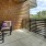 a patio with chairs and a table