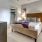 a bedroom with a bed and a table