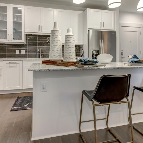 a kitchen with white cabinets