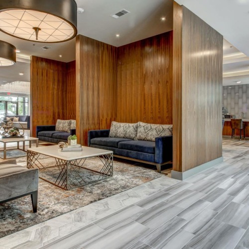 a room with a couch and chairs